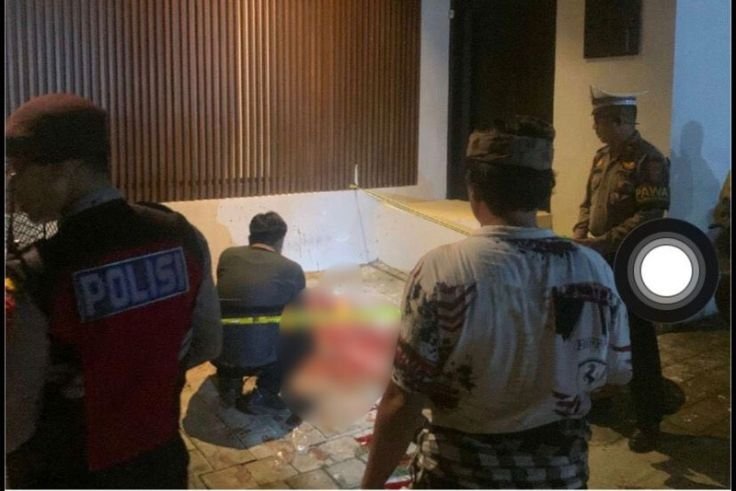 Police investigators examine the crime scene where a Dutch national was fatally stabbed in North Kuta.