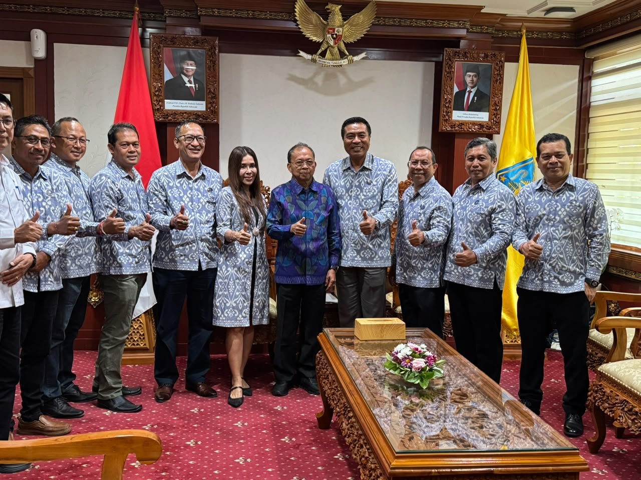 Bali Governor Wayan Koster poses for a group photo with Chairman of the Bali Chapter of the Association of the Indonesian Tours and Travel Agencies (ASITA), I Putu Winastra, S.AB., M.A.P., and members of the ASITA Bali board following a meeting to discuss preparations for the 15th ASITA Bali Regional Conference.
